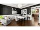 Home office featuring dark walls, hardwood floors, wainscoting, and plenty of room for work and study at 975 Garden Crossing Ln, Cumming, GA 30040