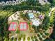 Overhead view of community amenities including tennis courts, a pool, playground, and clubhouse at 1517 Granby Ln, Locust Grove, GA 30248