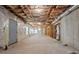 Expansive unfinished basement featuring insulated ceiling, concrete floor, and natural light at 1517 Granby Ln, Locust Grove, GA 30248