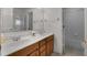 Bright bathroom with double sink vanity, and a separate shower and tub at 1517 Granby Ln, Locust Grove, GA 30248