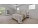 Bright bedroom with carpet, soft natural light, and a side table at 1517 Granby Ln, Locust Grove, GA 30248