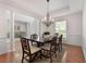 Beautiful dining area with large windows, decorative molding, and a chandelier at 1517 Granby Ln, Locust Grove, GA 30248