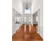 Bright and airy foyer with hardwood floors and a view into the living space at 1517 Granby Ln, Locust Grove, GA 30248