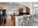 Open concept kitchen with bar seating, hardwood floors, and ample counter space at 1517 Granby Ln, Locust Grove, GA 30248