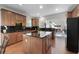 Spacious kitchen with wooden cabinets, granite countertops, and a central island at 1517 Granby Ln, Locust Grove, GA 30248