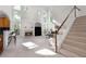 Sun-filled living room with fireplace, high ceilings, and a staircase at 1517 Granby Ln, Locust Grove, GA 30248