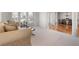 Bright living room with carpeting, traditional furniture, and large windows at 1517 Granby Ln, Locust Grove, GA 30248