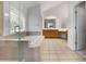 Luxurious bathroom featuring a large tub, separate shower, and double vanity at 1517 Granby Ln, Locust Grove, GA 30248
