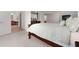 Bright main bedroom featuring a large bed, ensuite bathroom, and walk-in closet at 1517 Granby Ln, Locust Grove, GA 30248