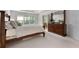 Bright main bedroom featuring a large bed, coffered ceilings, and an ensuite bathroom at 1517 Granby Ln, Locust Grove, GA 30248