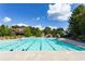 Large community swimming pool with plenty of space for swimming and relaxation, on a sunny day at 1517 Granby Ln, Locust Grove, GA 30248