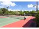 Well-maintained tennis courts with new nets and viewing benches, ready for a friendly match at 1517 Granby Ln, Locust Grove, GA 30248