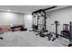 Finished basement with carpet, work out equipment, bench and a weight rack at 9 Buckhorn Dr, Temple, GA 30179