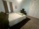 Comfortable bedroom with a bed, desk, and ample closet space at 9 Buckhorn Dr, Temple, GA 30179