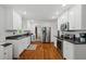 Bright kitchen featuring stainless appliances, granite countertops, and white cabinets at 9 Buckhorn Dr, Temple, GA 30179