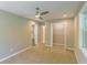 Cozy bedroom boasts neutral walls, plush carpet flooring, modern ceiling fan, walk in closet, and a window at 3207 Canary Ct, Decatur, GA 30032