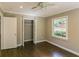 Well-lit bedroom features hardwood flooring, closet, neutral walls, white trim, and a window with a view at 3207 Canary Ct, Decatur, GA 30032
