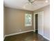 Bedroom with hardwood flooring, neutral walls, bright ceiling fan, white trim and a closet at 3207 Canary Ct, Decatur, GA 30032