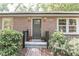 Charming brick home entrance with a decorative front door, brick path and lush landscaping at 3207 Canary Ct, Decatur, GA 30032