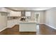 Modern kitchen with white cabinets, a granite island, and stainless steel appliances at 3207 Canary Ct, Decatur, GA 30032