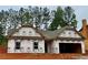Charming new construction home with a two-car garage and inviting curb appeal, ready for personalization at 486 Charleston Pl, Villa Rica, GA 30180