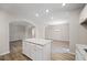 Open concept kitchen with island, granite countertops, view to the dining room at 486 Charleston Pl, Villa Rica, GA 30180