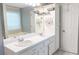 Bright bathroom with double sinks and a large mirror, providing ample counter space at 1043 Foxhollow Trl, Canton, GA 30115