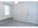 Bright bedroom with neutral carpet and white trim at 1043 Foxhollow Trl, Canton, GA 30115