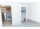 Bedroom view showing white door and a glimpse of the compact kitchen at 1043 Foxhollow Trl, Canton, GA 30115