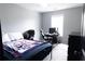 Bedroom with a large window, desk, and two chairs at 1043 Foxhollow Trl, Canton, GA 30115
