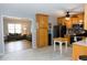 Traditional kitchen open to the living room, with wood cabinets and stainless steel appliances at 1043 Foxhollow Trl, Canton, GA 30115