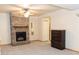 Cozy living room with stone fireplace and ceiling fan at 1043 Foxhollow Trl, Canton, GA 30115