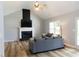 Spacious living room with vaulted ceilings, a fireplace, and wood floors at 1043 Foxhollow Trl, Canton, GA 30115
