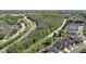 A scenic aerial shot reveals a tree-lined road near a residential area on a bright, clear day at 1610 Glenhurst Dr, Snellville, GA 30078
