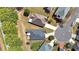 An overhead shot showing the layout of multiple homes and their yards in a suburban neighborhood at 1610 Glenhurst Dr, Snellville, GA 30078