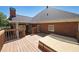 A partial side view of the back of the house with a hot tub and deck at 1610 Glenhurst Dr, Snellville, GA 30078
