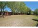Large backyard with privacy fence and large trees at 1610 Glenhurst Dr, Snellville, GA 30078