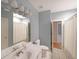 Bathroom featuring a double sink vanity, tiled floor, and shower with curtain at 1610 Glenhurst Dr, Snellville, GA 30078