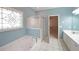 Beautiful bathroom features a soaking tub, shower, and double sink vanity at 1610 Glenhurst Dr, Snellville, GA 30078