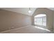 Bright bedroom with vaulted ceilings, neutral carpeting, and a large window providing ample natural light at 1610 Glenhurst Dr, Snellville, GA 30078