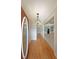 Inviting foyer featuring hardwood floors, decorative lighting, and an open view to the dining space at 1610 Glenhurst Dr, Snellville, GA 30078
