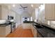 Well-appointed kitchen featuring stainless steel appliances, granite countertops, and updated white cabinetry at 1610 Glenhurst Dr, Snellville, GA 30078
