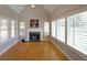 Charming living room with a fireplace, hardwood floors, plantation shutters, and a vaulted ceiling at 1610 Glenhurst Dr, Snellville, GA 30078