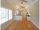 Open-concept living space with vaulted ceilings, hardwood floors, and views to the modern kitchen at 1610 Glenhurst Dr, Snellville, GA 30078