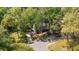 Aerial view of a charming home nestled among mature trees and lush landscaping at 2441 Mitchell Ne Rd, Marietta, GA 30062