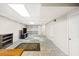 Finished basement area with built-in shelving, neutral flooring, and convenient access to storage or utility areas at 2441 Mitchell Ne Rd, Marietta, GA 30062