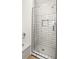Modern bathroom showcases a glass-enclosed shower with white subway tile and stylish fixtures at 2441 Mitchell Ne Rd, Marietta, GA 30062