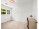 Well-lit bedroom with neutral colors features a window, carpet flooring, and spacious design at 2441 Mitchell Ne Rd, Marietta, GA 30062