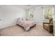 Bright bedroom features a queen-sized bed, natural light from the windows, and comfortable chair at 2441 Mitchell Ne Rd, Marietta, GA 30062