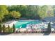 A refreshing community pool area with ample seating, surrounded by lush greenery, perfect for relaxation and recreation at 2441 Mitchell Ne Rd, Marietta, GA 30062